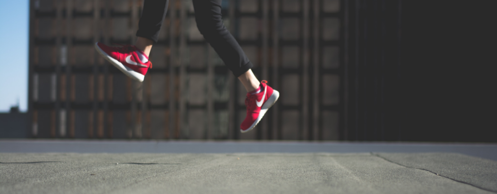 Image of a person's legs taking a leap showing how self-directed learning can improve performance